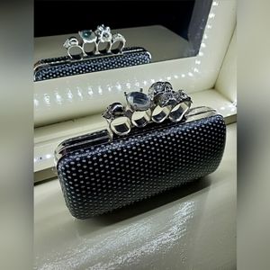 Brass knuckle/skull clutch